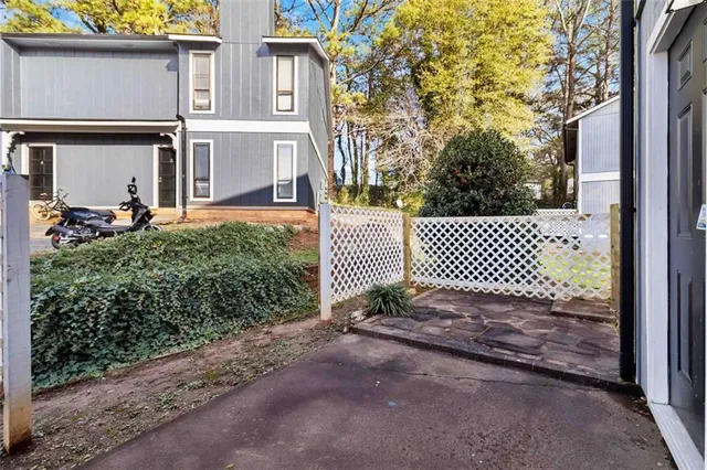 a view of a brick house with a large windows