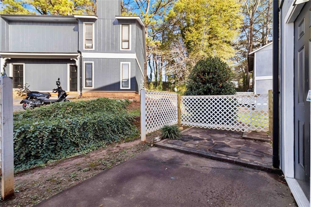 2340 Beaver Ruin Road, Unit 16 Norcross, GA 30071 - Photo 25 of 28 a view of a brick house with a large windows