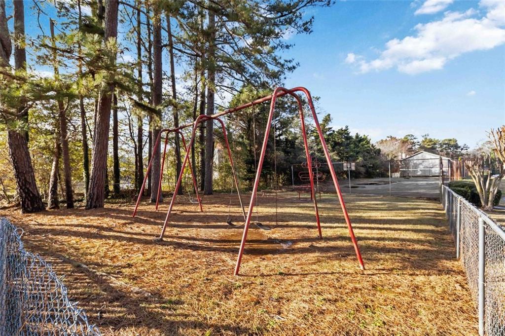 2340 Beaver Ruin Road, Unit 16 Norcross, GA 30071 - Photo 27 of 28 a view of a houses with a park