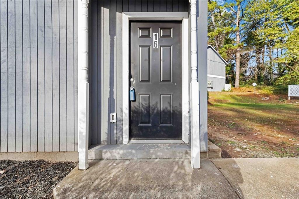 2340 Beaver Ruin Road, Unit 16 Norcross, GA 30071 - Photo 3 of 28 a view of a house with a outdoor space