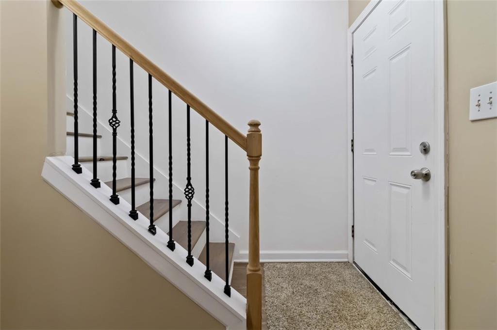 2340 Beaver Ruin Road, Unit 16 Norcross, GA 30071 - Photo 5 of 28 a view of staircase with railing and white walls
