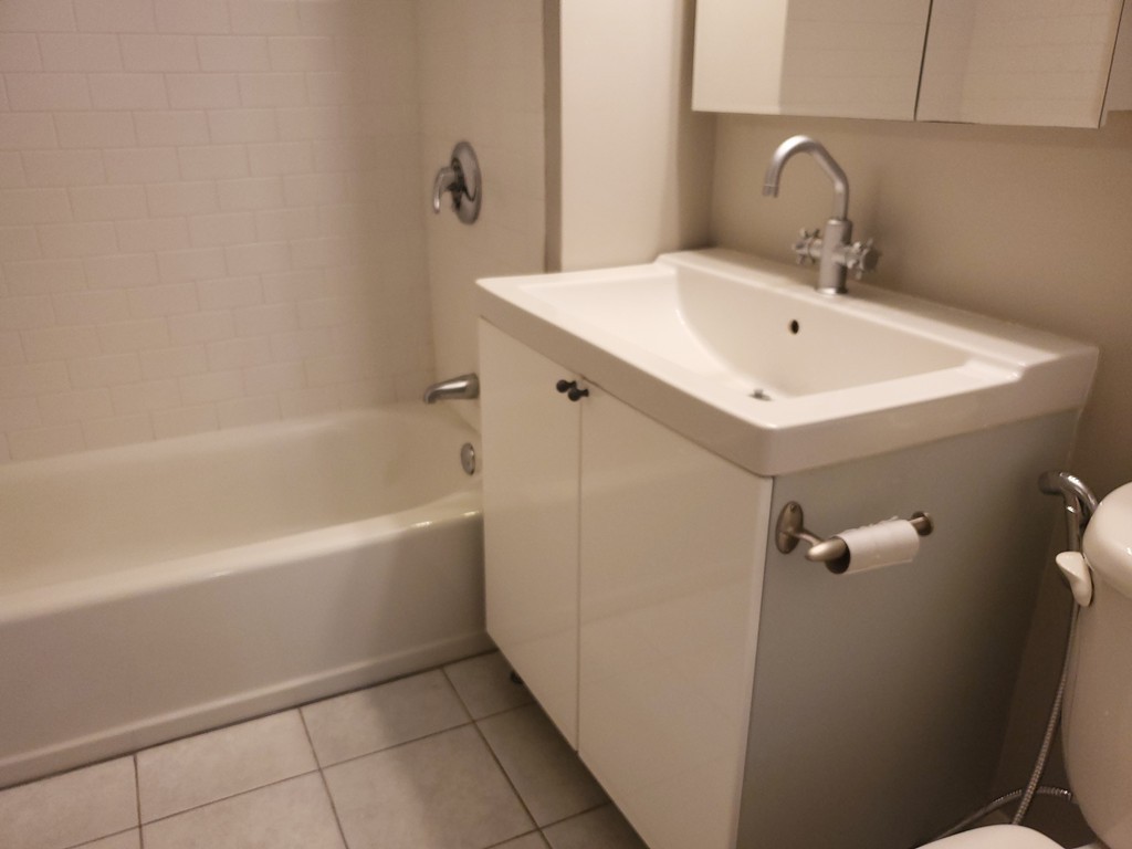 60 Dudley Street, Unit 22 Chelsea, MA 02150 - Photo 11 of 15 a bathroom with a sink and mirror