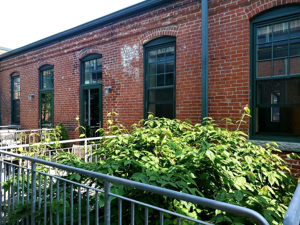 60 Dudley Street, Unit 22 Chelsea, MA 02150 - Photo 13 of 15 a view of a brick house with a large window
