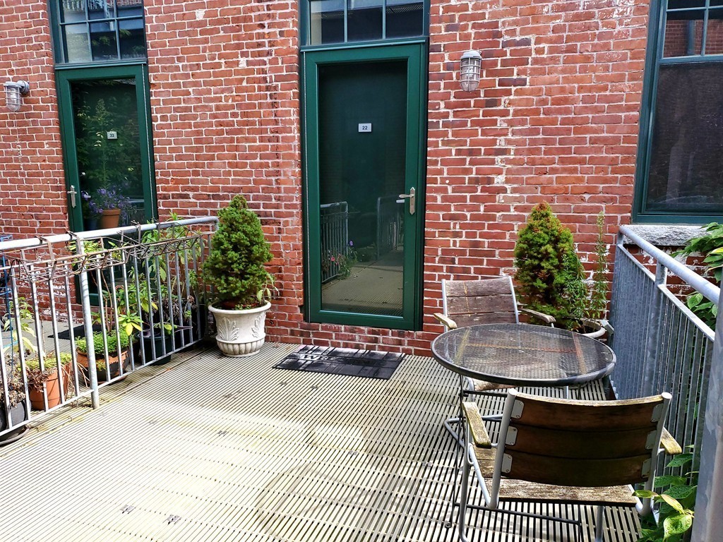 60 Dudley Street, Unit 22 Chelsea, MA 02150 - Photo 4 of 15 a view of a house with a patio