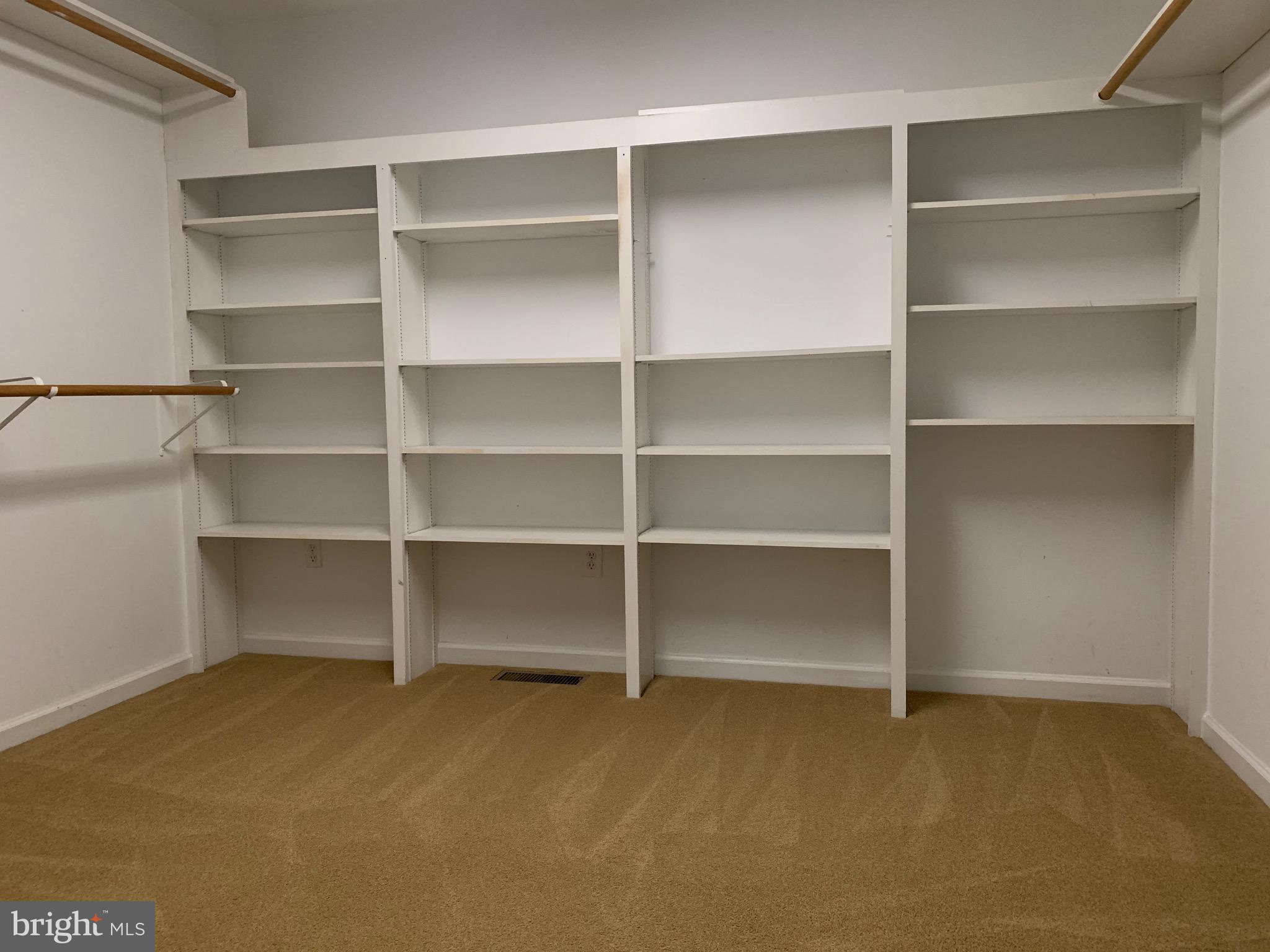 8474 Leeds Manor Road Warrenton, VA 20186 - Photo 16 of 38 walk in closet in primary bedroom suite