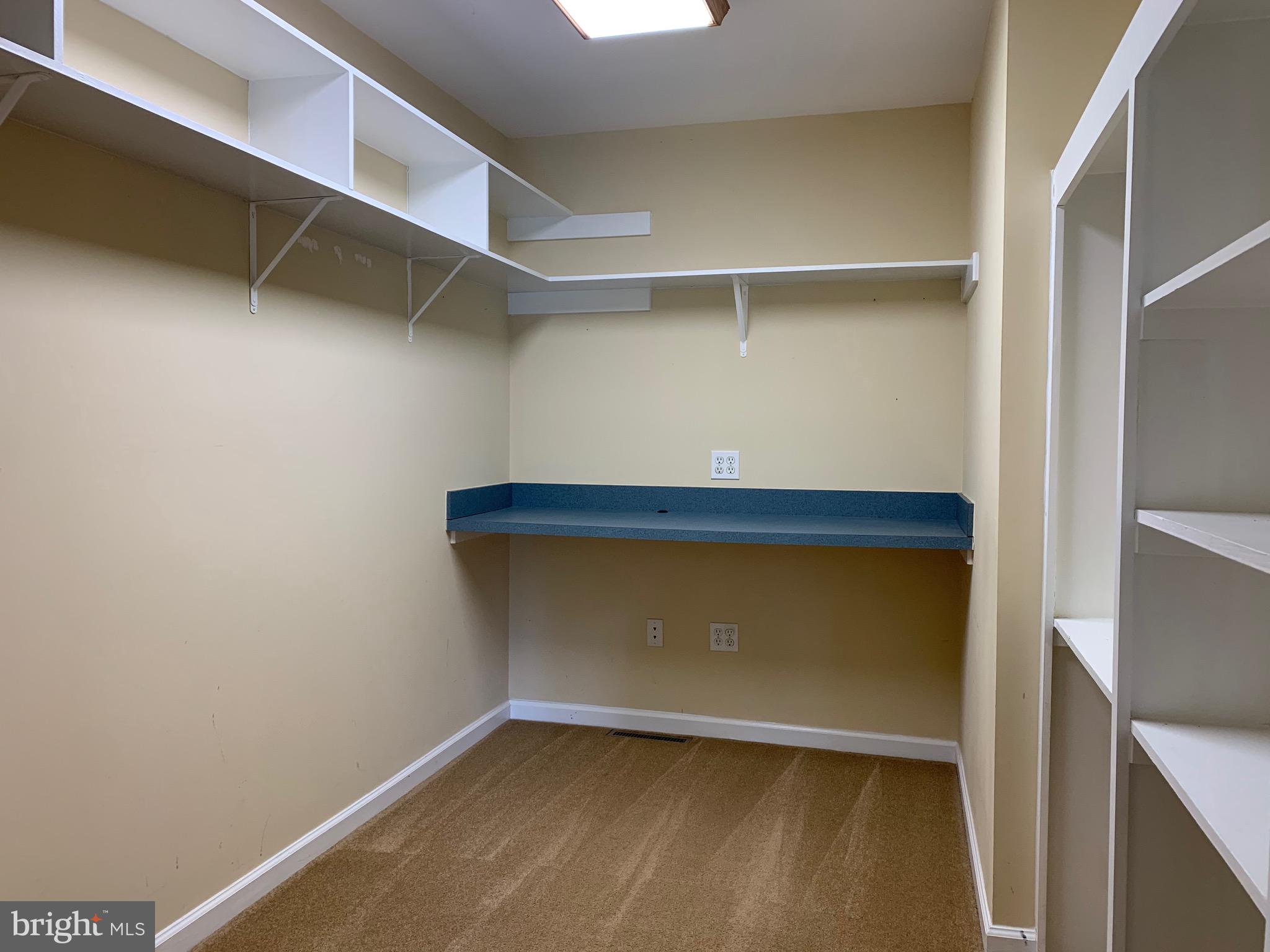 8474 Leeds Manor Road Warrenton, VA 20186 - Photo 17 of 38 walk in closet in primary bedroom suite