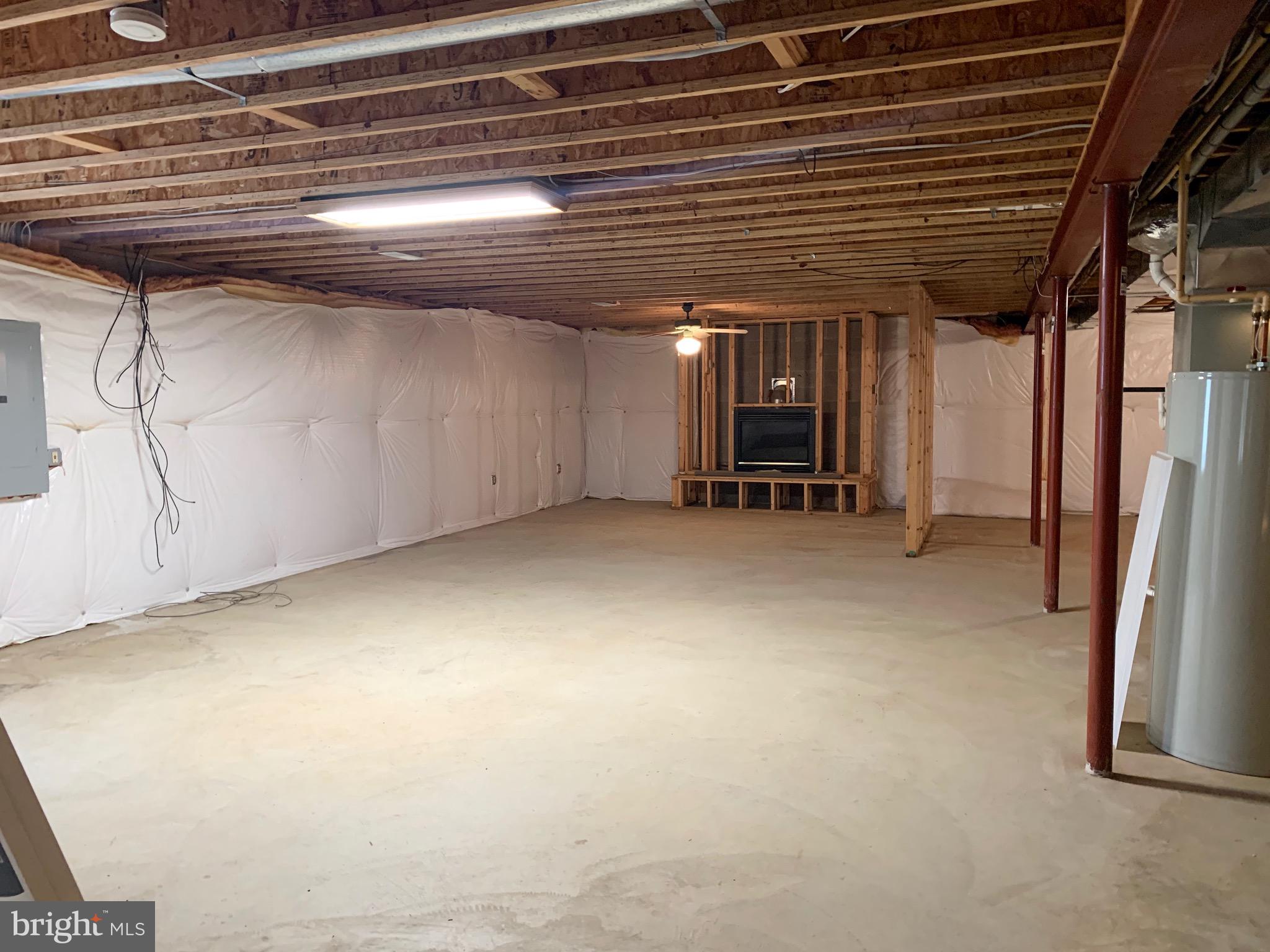 8474 Leeds Manor Road Warrenton, VA 20186 - Photo 23 of 38 unfinished walk out basement with fireplace