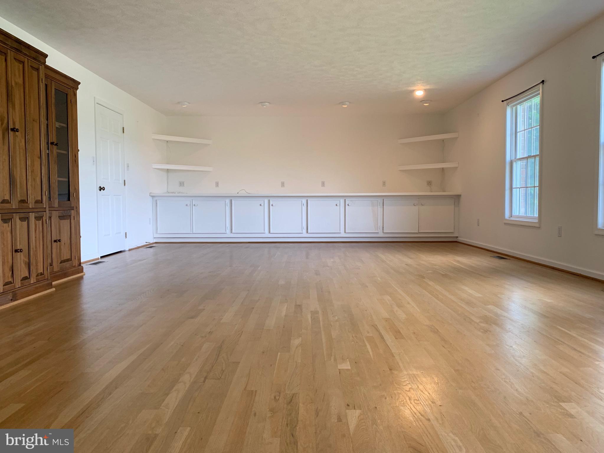 8474 Leeds Manor Road Warrenton, VA 20186 - Photo 10 of 38 family room with tons of storage