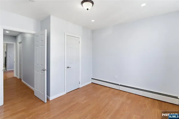 a front view of a house with parking space