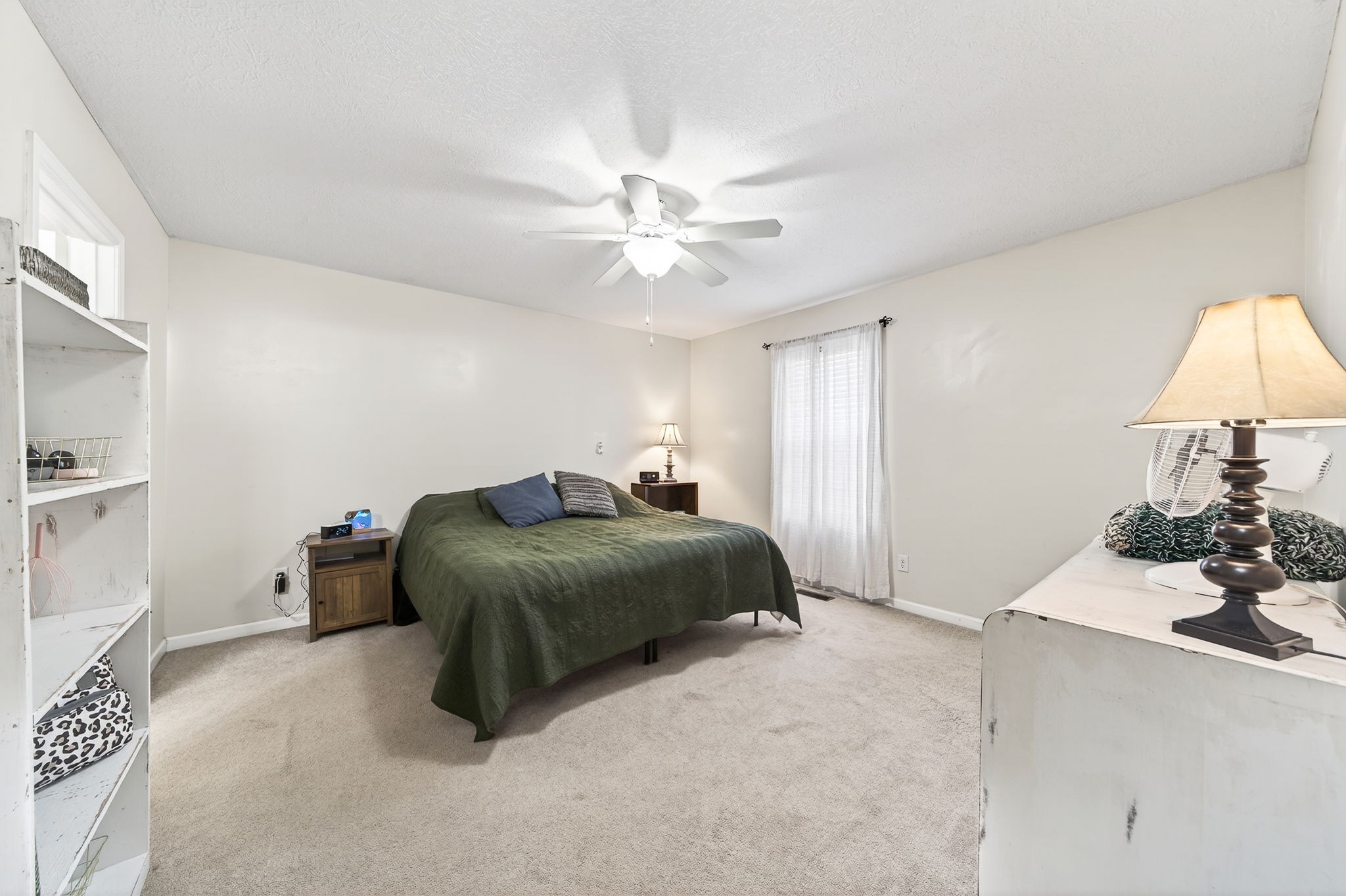 4535 Ewing Drive Baxter, TN 38544 - Photo 13 of 32 a bedroom with a bed and a chandelier