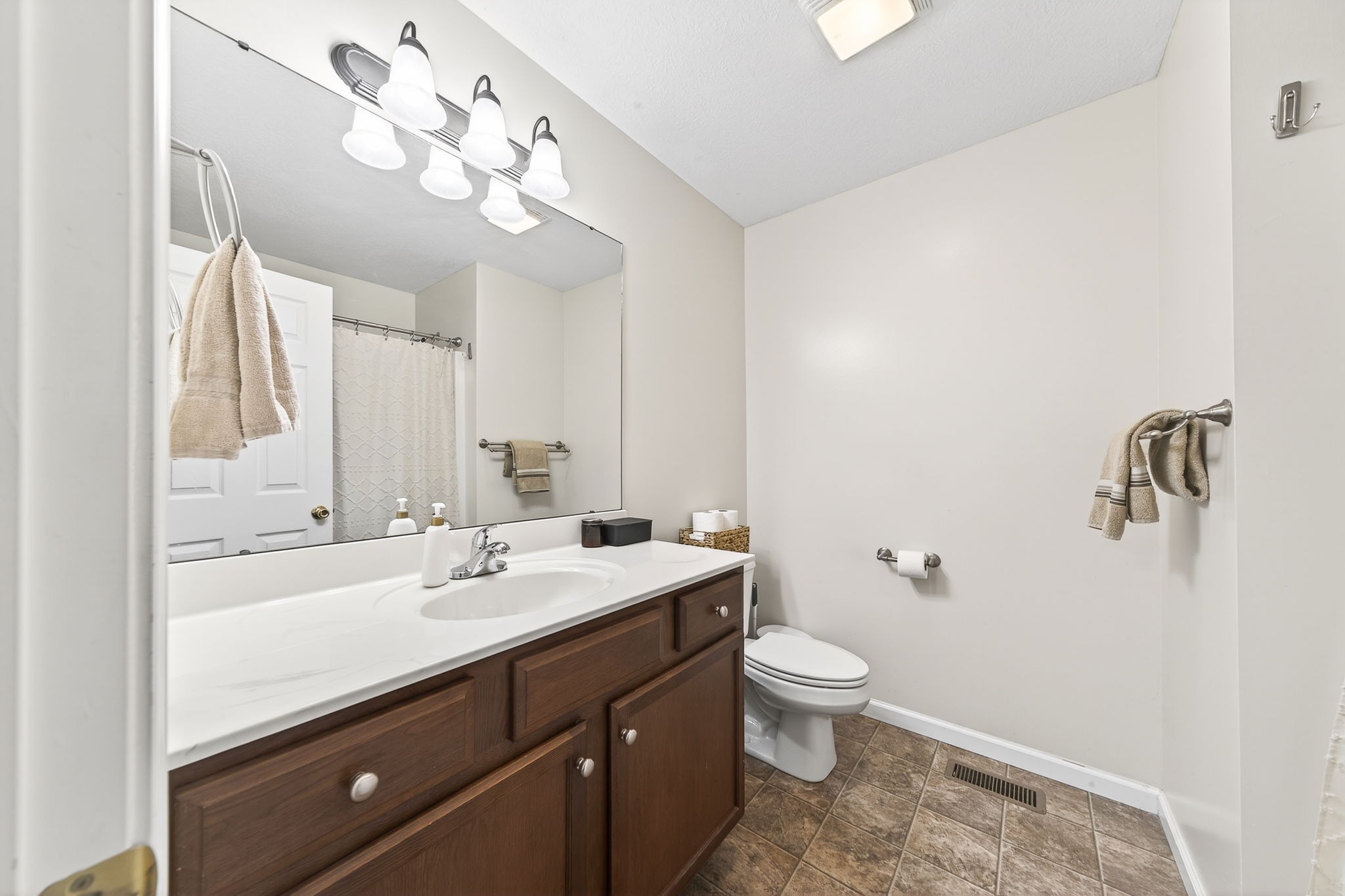 4535 Ewing Drive Baxter, TN 38544 - Photo 15 of 32 a bathroom with a sink a toilet and a mirror