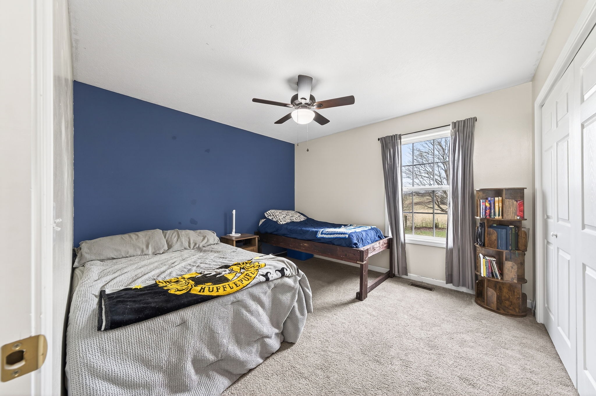 4535 Ewing Drive Baxter, TN 38544 - Photo 16 of 32 a bed sitting in a bedroom next to a window