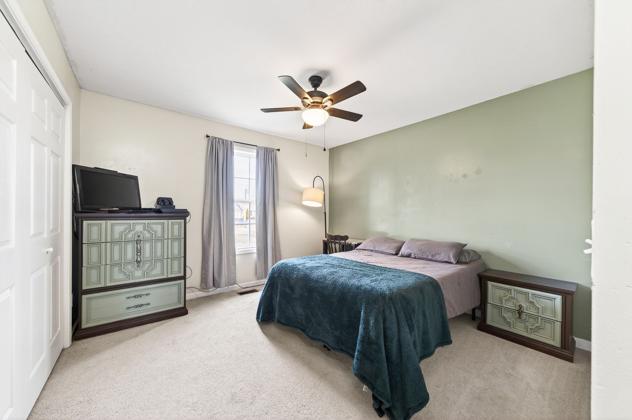 4535 Ewing Drive Baxter, TN 38544 - Photo 17 of 32 a spacious bedroom with a bed and a ceiling fan