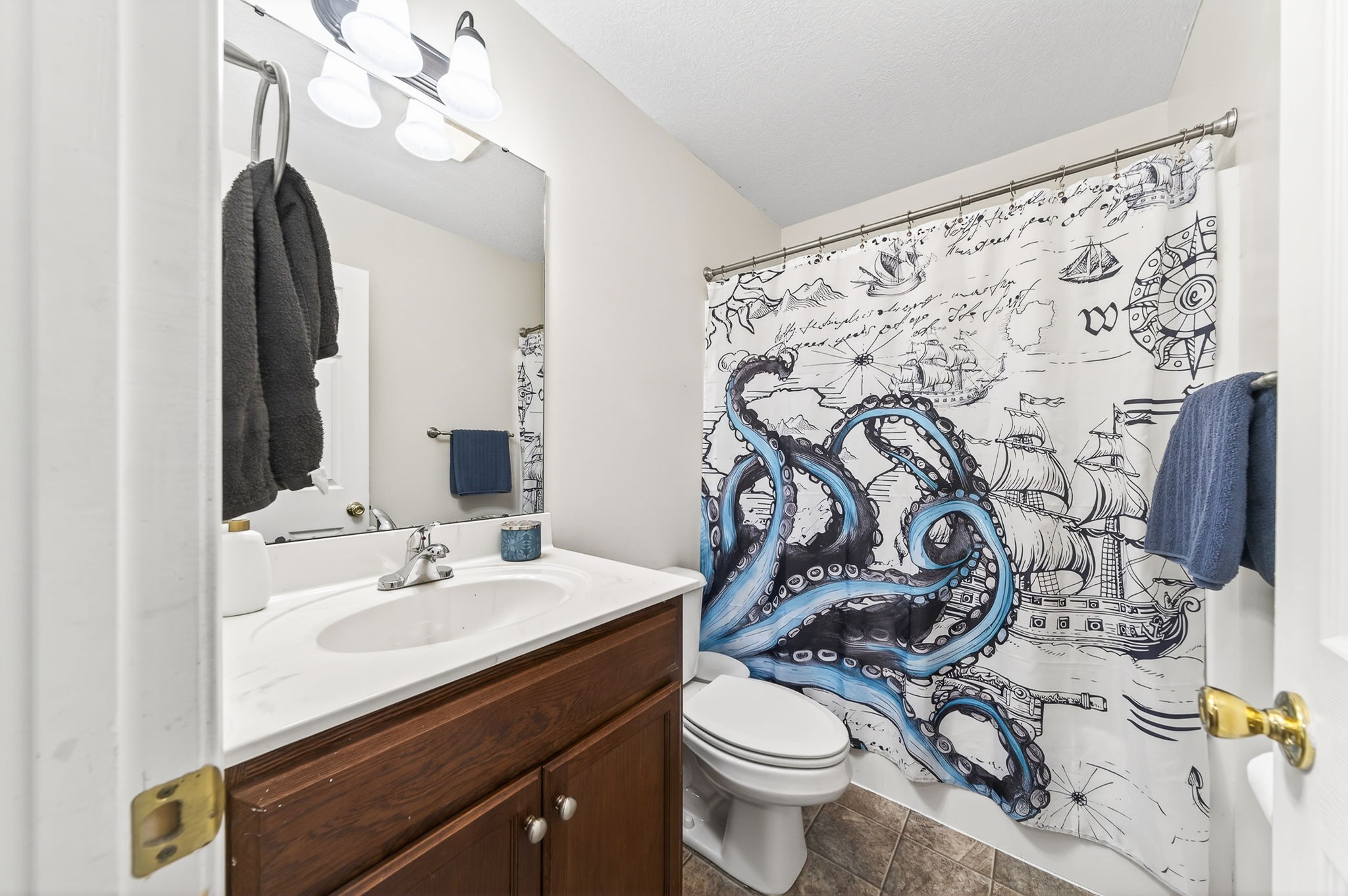 4535 Ewing Drive Baxter, TN 38544 - Photo 18 of 32 a bathroom with a sink vanity mirror and toilet