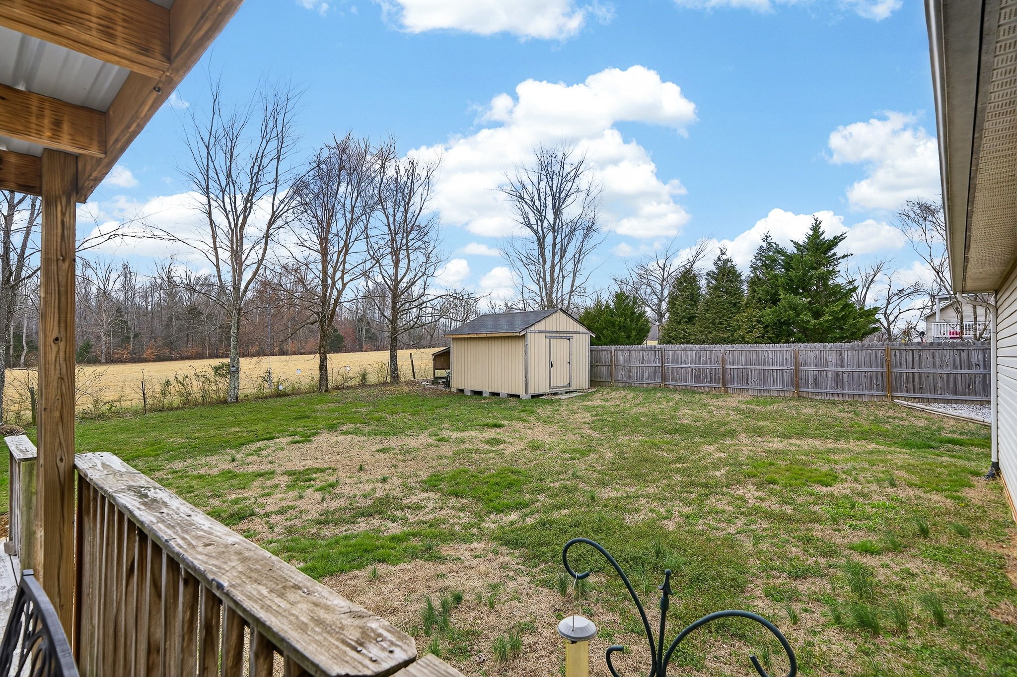 4535 Ewing Drive Baxter, TN 38544 - Photo 20 of 32 a backyard of a house with lots of green space