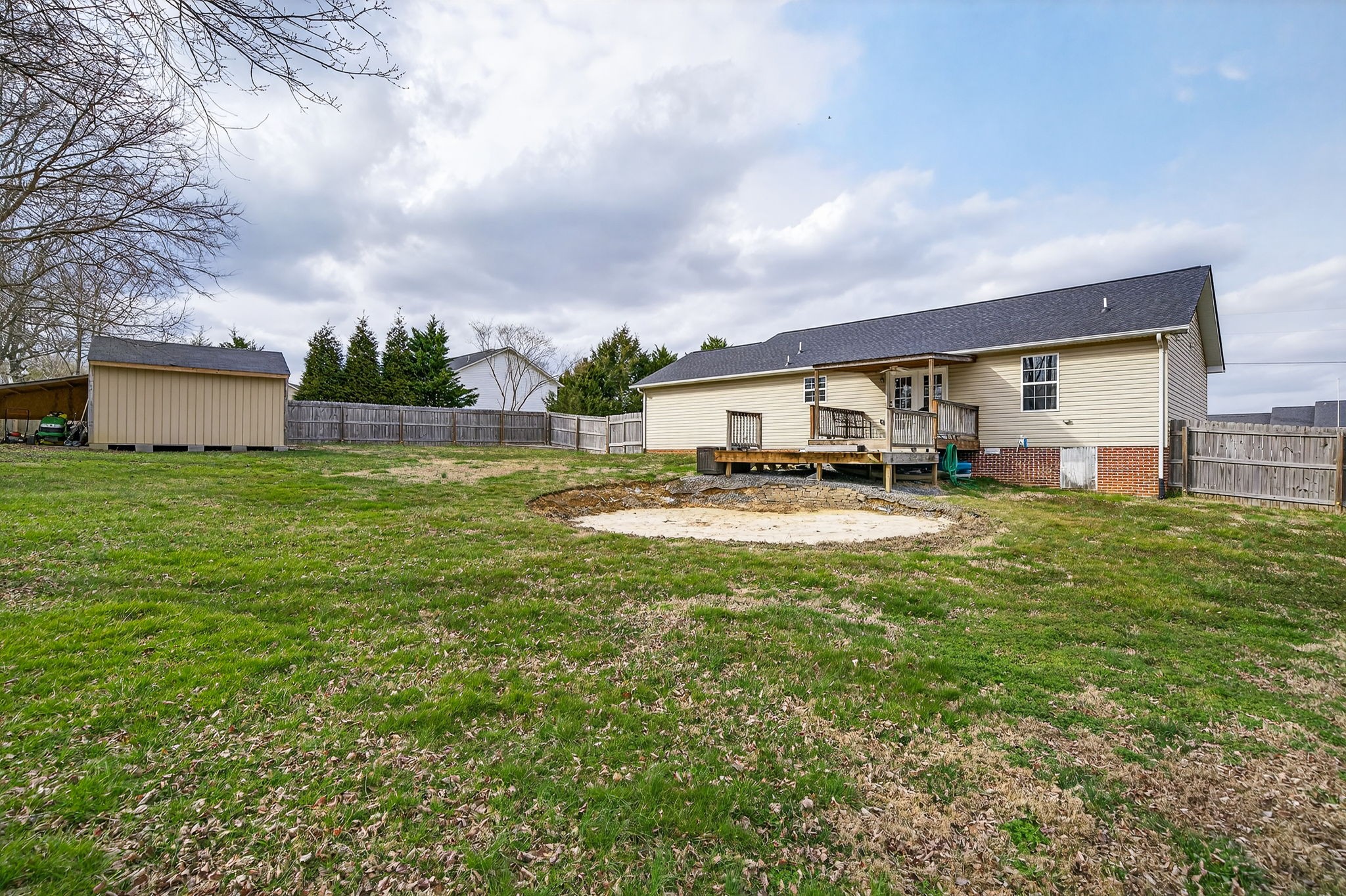 4535 Ewing Drive Baxter, TN 38544 - Photo 22 of 32 a view of pool with lawn chairs and large trees