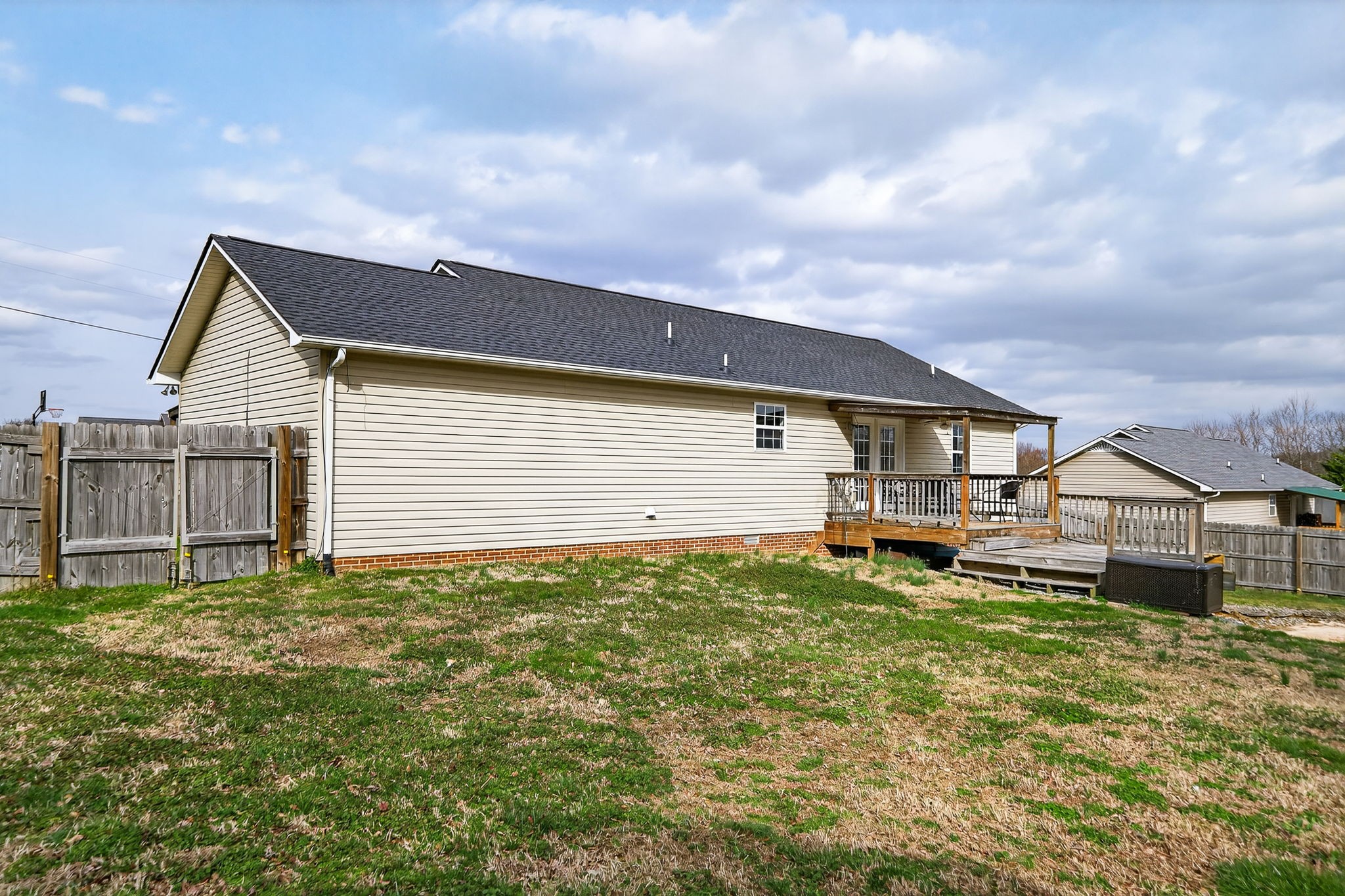 4535 Ewing Drive Baxter, TN 38544 - Photo 23 of 32 a backyard of a house with table and chairs