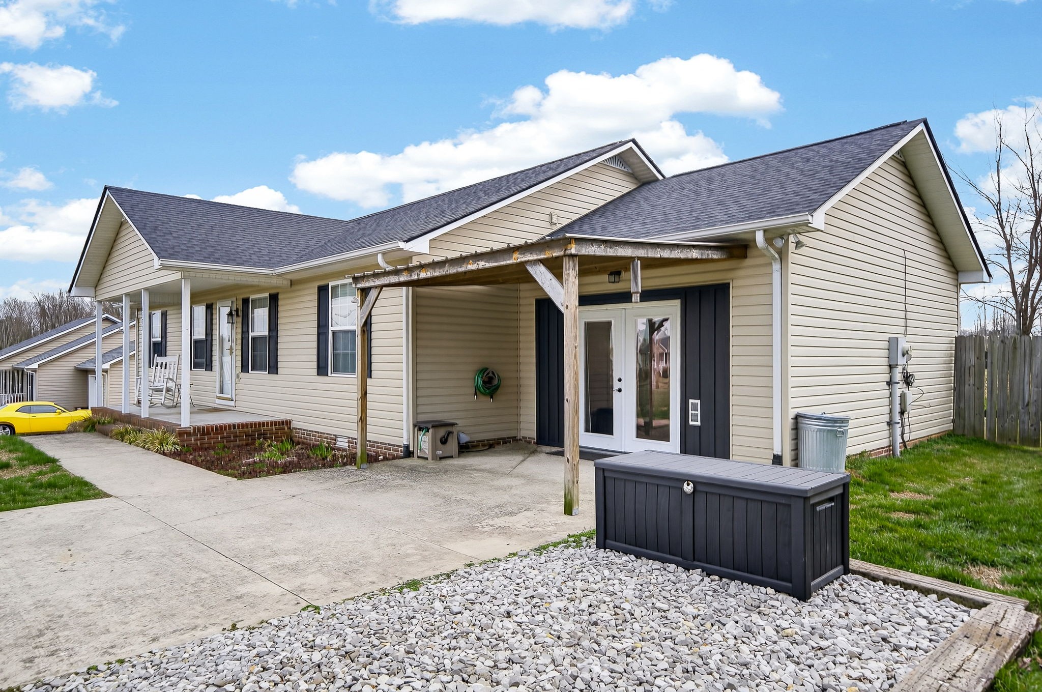 4535 Ewing Drive Baxter, TN 38544 - Photo 25 of 32 a front view of a house with garden