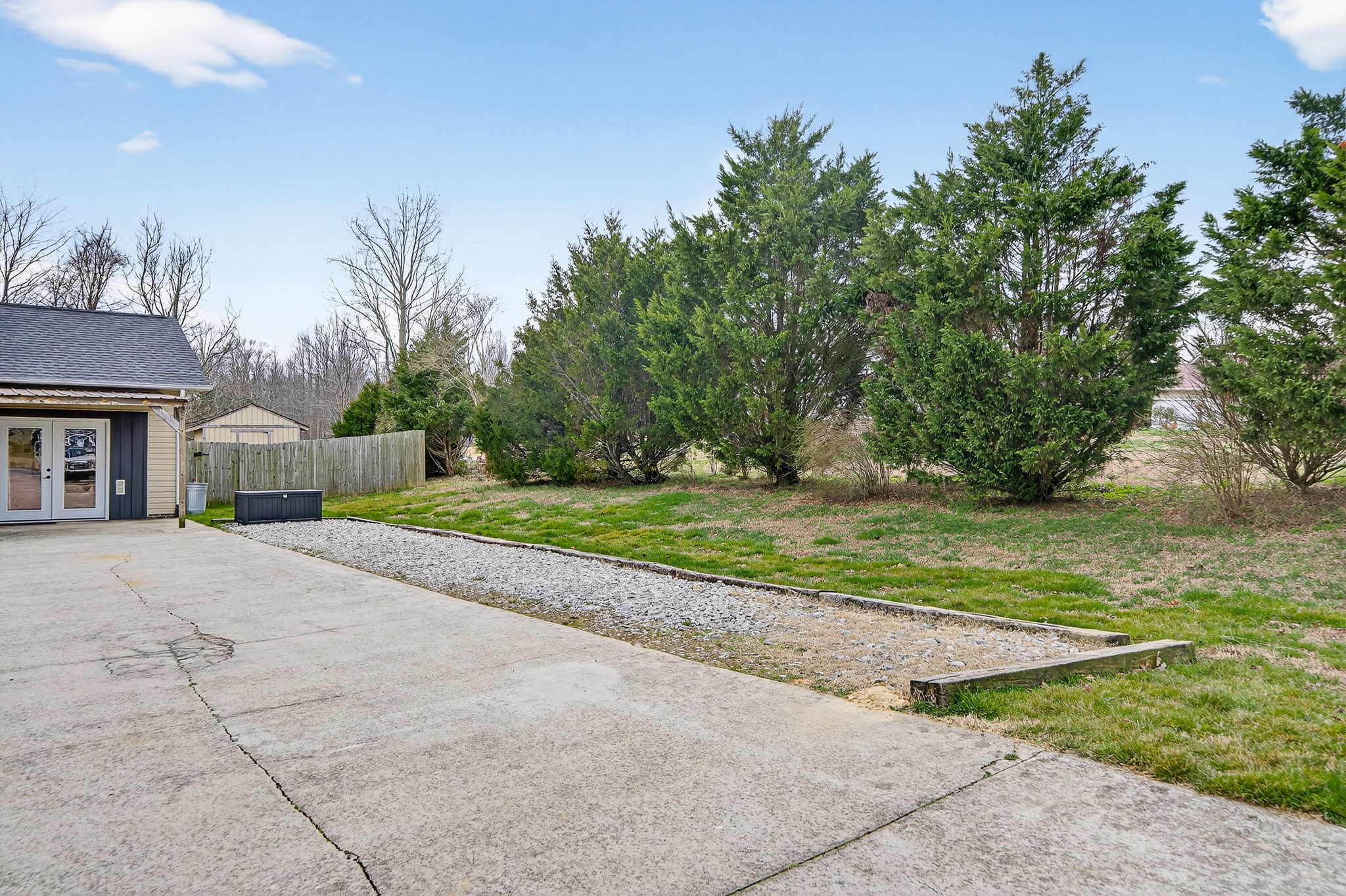 4535 Ewing Drive Baxter, TN 38544 - Photo 27 of 32 a view of a house with backyard and a garden