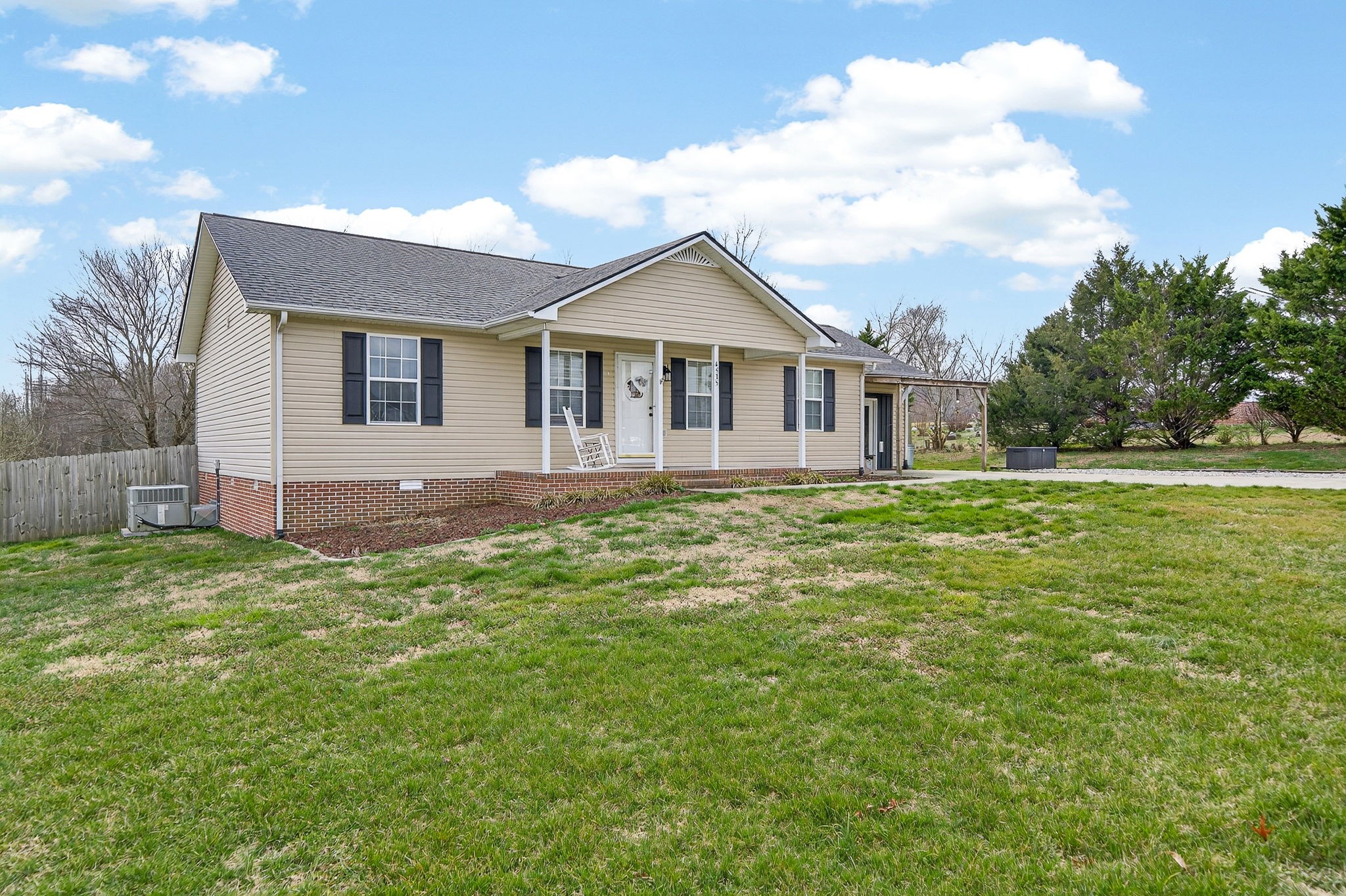4535 Ewing Drive Baxter, TN 38544 - Photo 29 of 32 a front view of a house with a garden