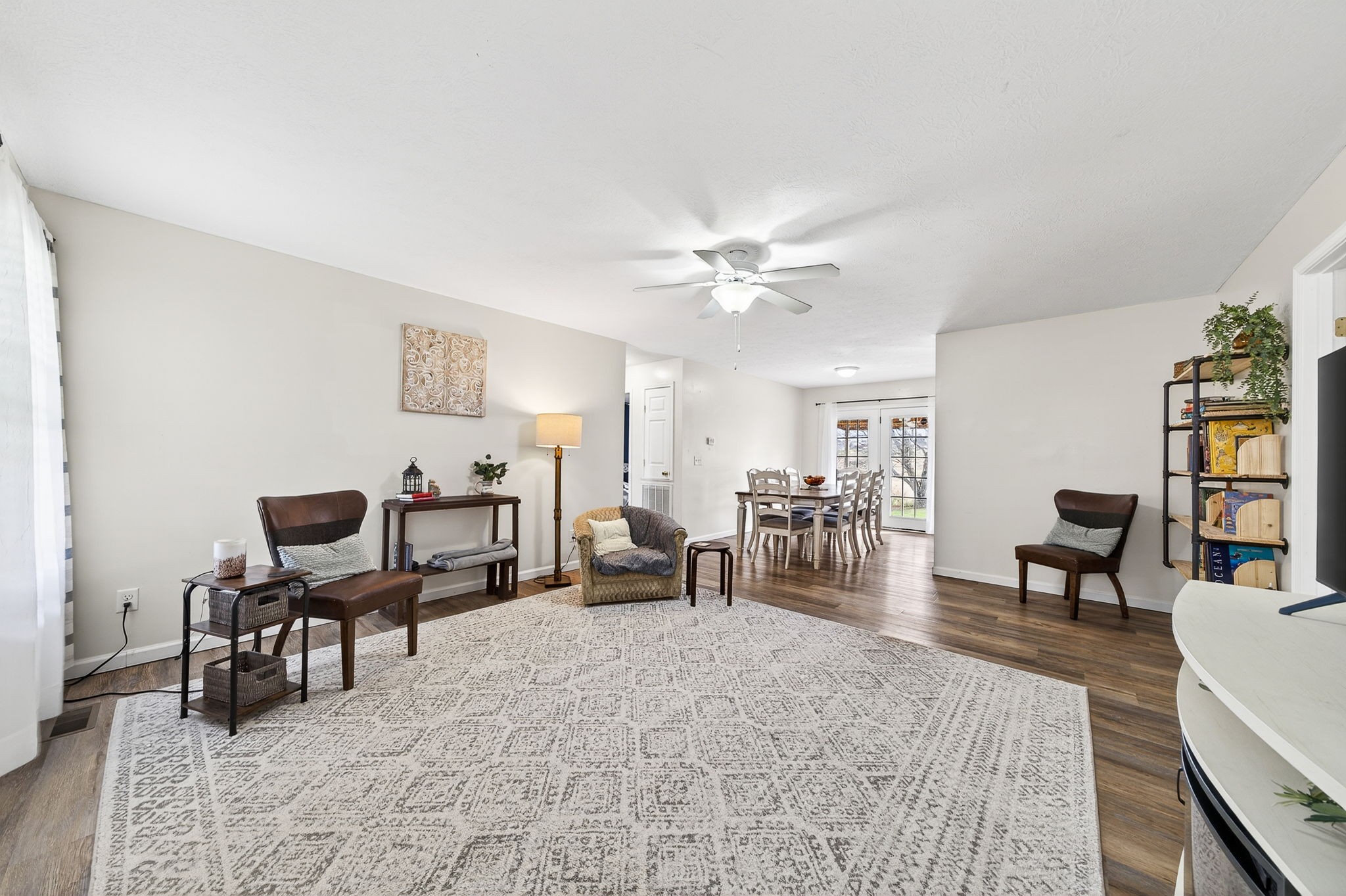 4535 Ewing Drive Baxter, TN 38544 - Photo 5 of 32 a living room with furniture and a dining table with wooden floor
