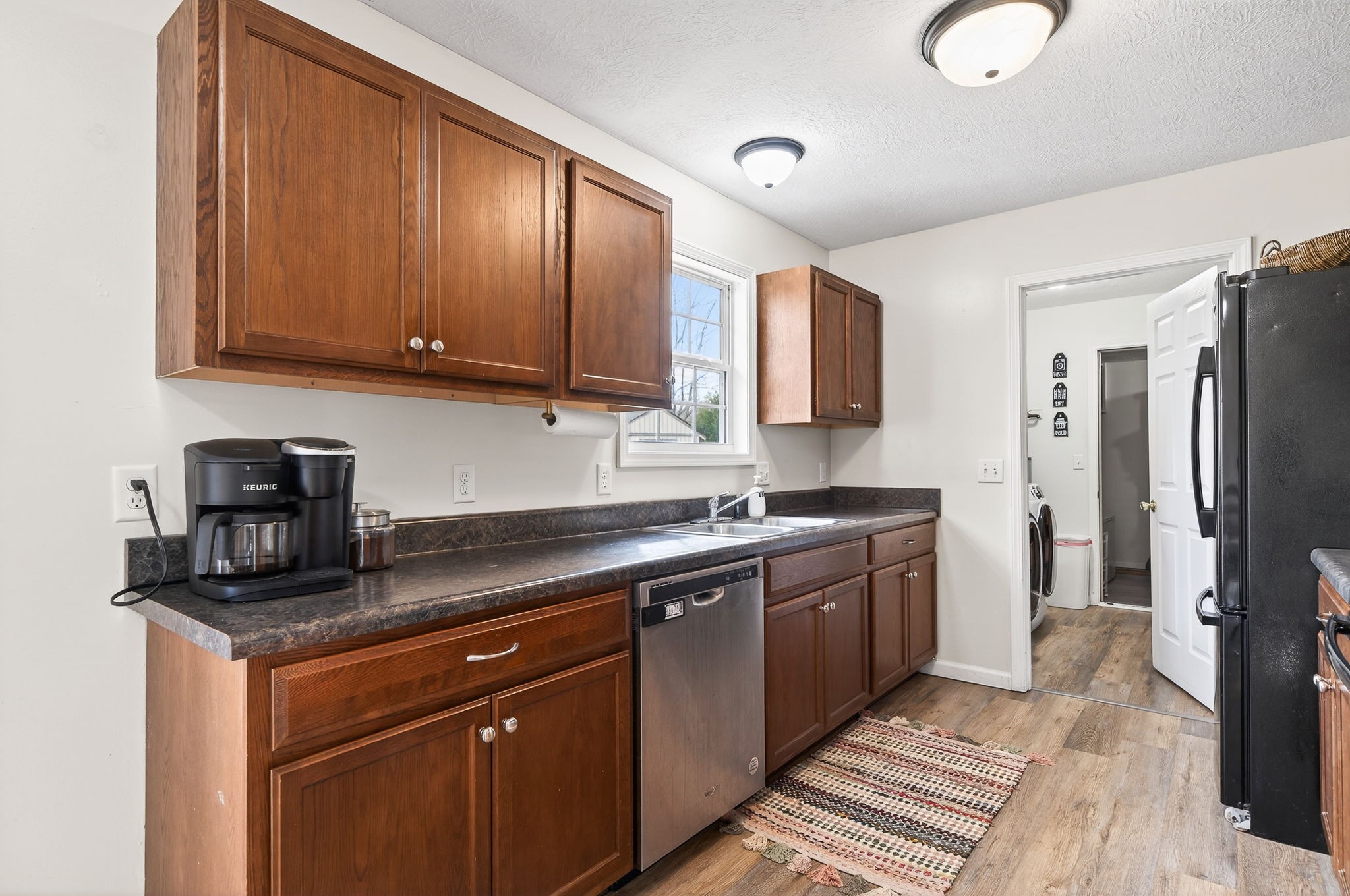4535 Ewing Drive Baxter, TN 38544 - Photo 7 of 32 a kitchen with stainless steel appliances granite countertop a sink stove and refrigerator
