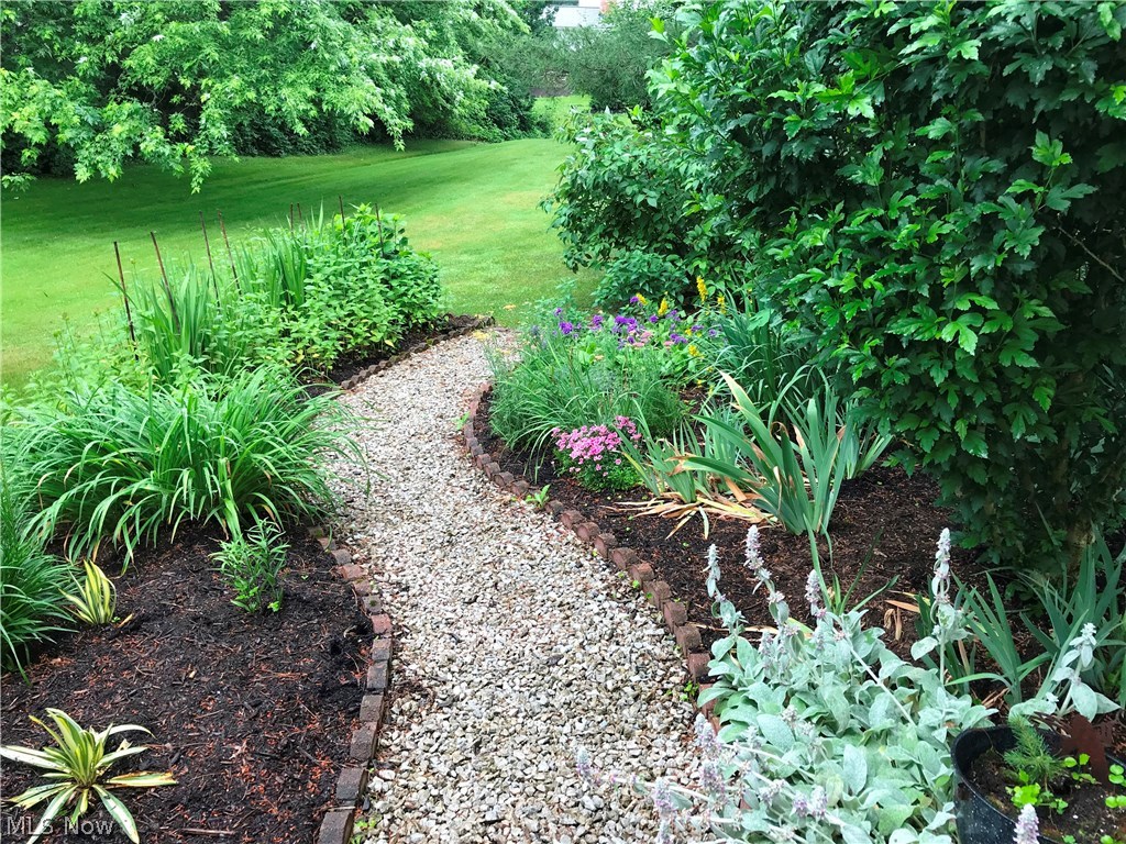 104 Hurd Road Aurora, OH 44202 - Photo 28 of 30 Love the stone paths that go around the home.