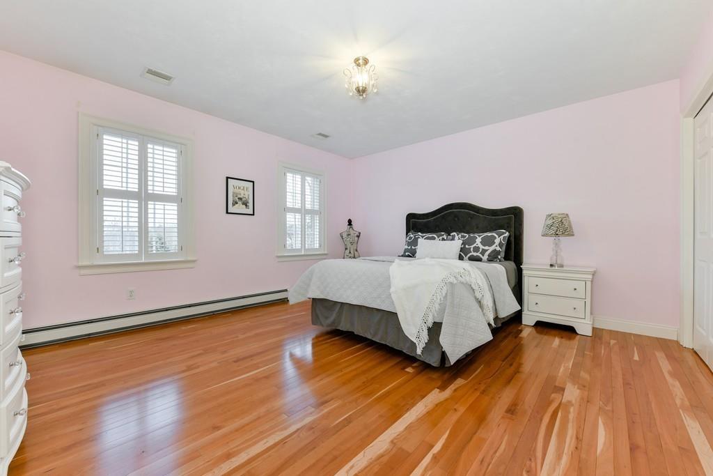 184 Fox Run Road Bolton, MA 01740 - Photo 23 of 39 a bed sitting in a spacious bedroom next to a window