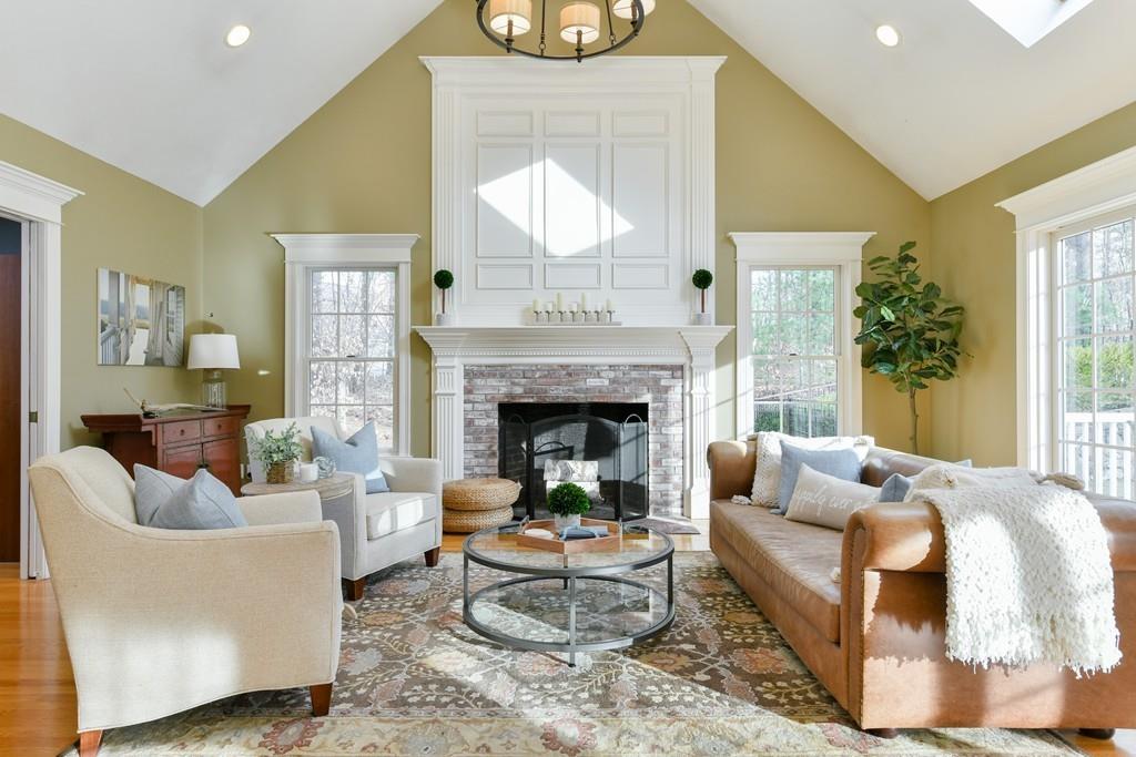 184 Fox Run Road Bolton, MA 01740 - Photo 3 of 39 a living room with furniture a fireplace and a large window