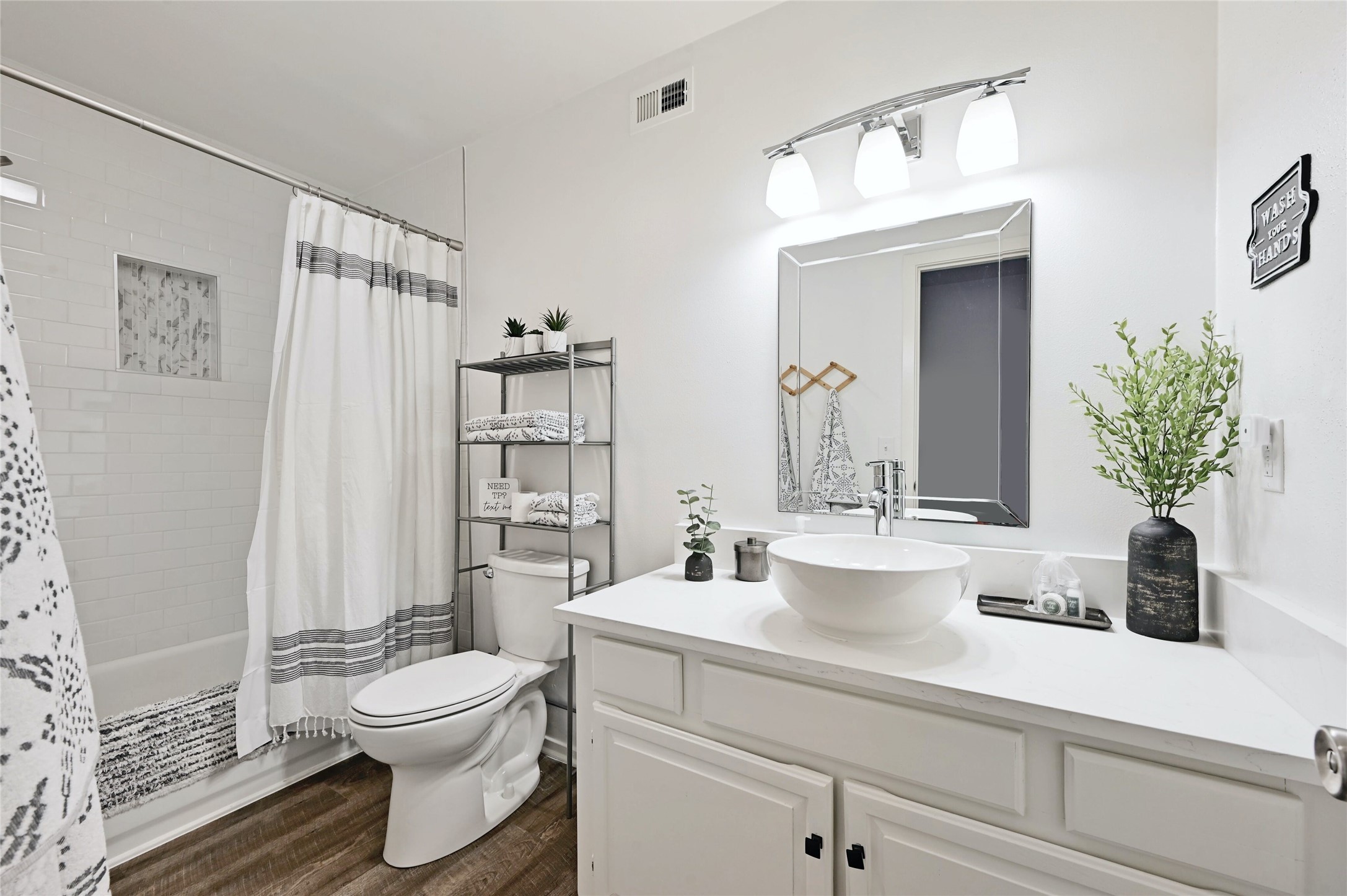 115 Comanche Drive Point Venture, TX 78645 - Photo 19 of 40 a bathroom with a sink a toilet and shower