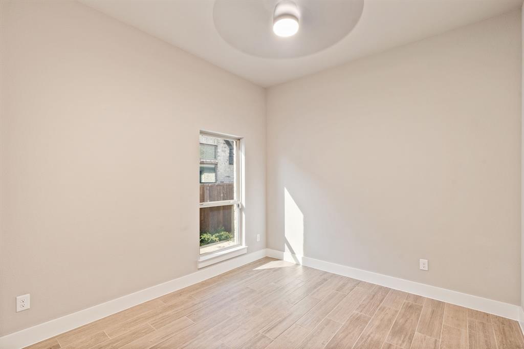 1314 Buttermere Street Forney, TX 75126 - Photo 19 of 32 a view of wooden floor and windows in a room