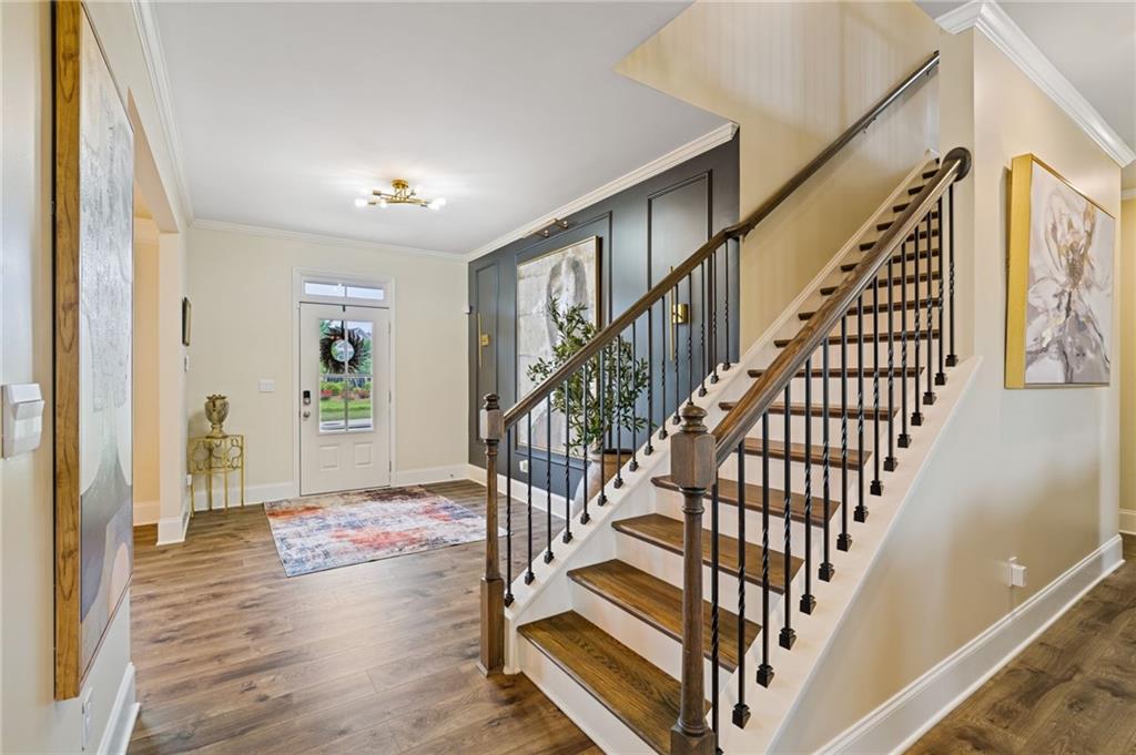 304 Ellenton Place Canton, GA 30115 - Photo 14 of 76 a view of entryway with wooden floor and stairs
