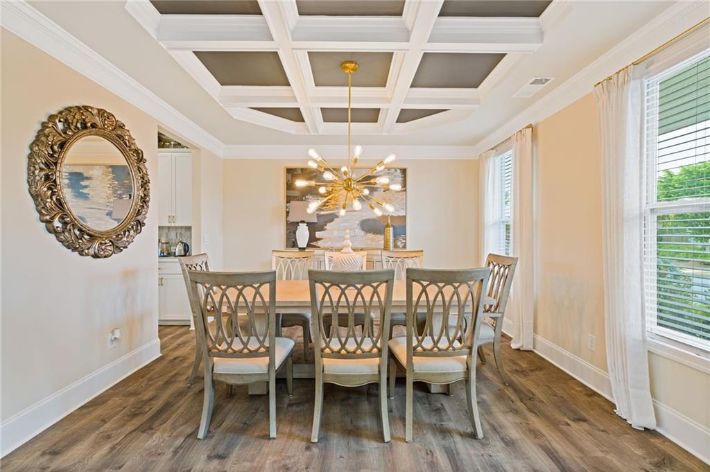 304 Ellenton Place Canton, GA 30115 - Photo 15 of 76 a view of a dining room with furniture window and wooden floor
