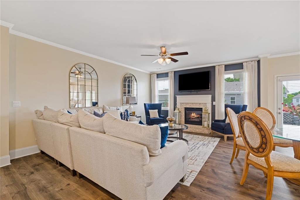 304 Ellenton Place Canton, GA 30115 - Photo 17 of 76 a living room with furniture a fireplace and a flat screen tv