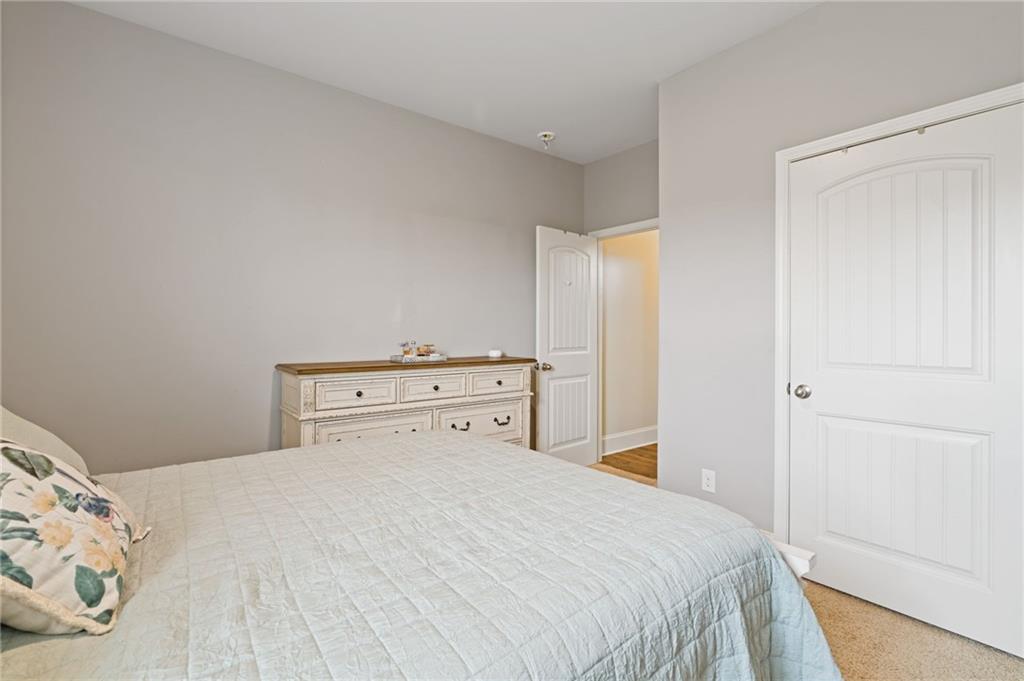 304 Ellenton Place Canton, GA 30115 - Photo 35 of 76 a bedroom with a bed and a window