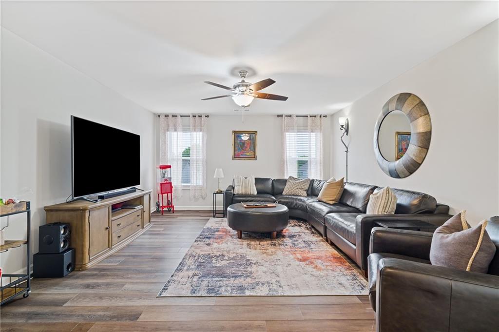 304 Ellenton Place Canton, GA 30115 - Photo 37 of 76 a living room with furniture and a flat screen tv