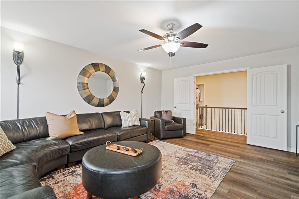 304 Ellenton Place Canton, GA 30115 - Photo 38 of 76 a living room with furniture a rug and a window