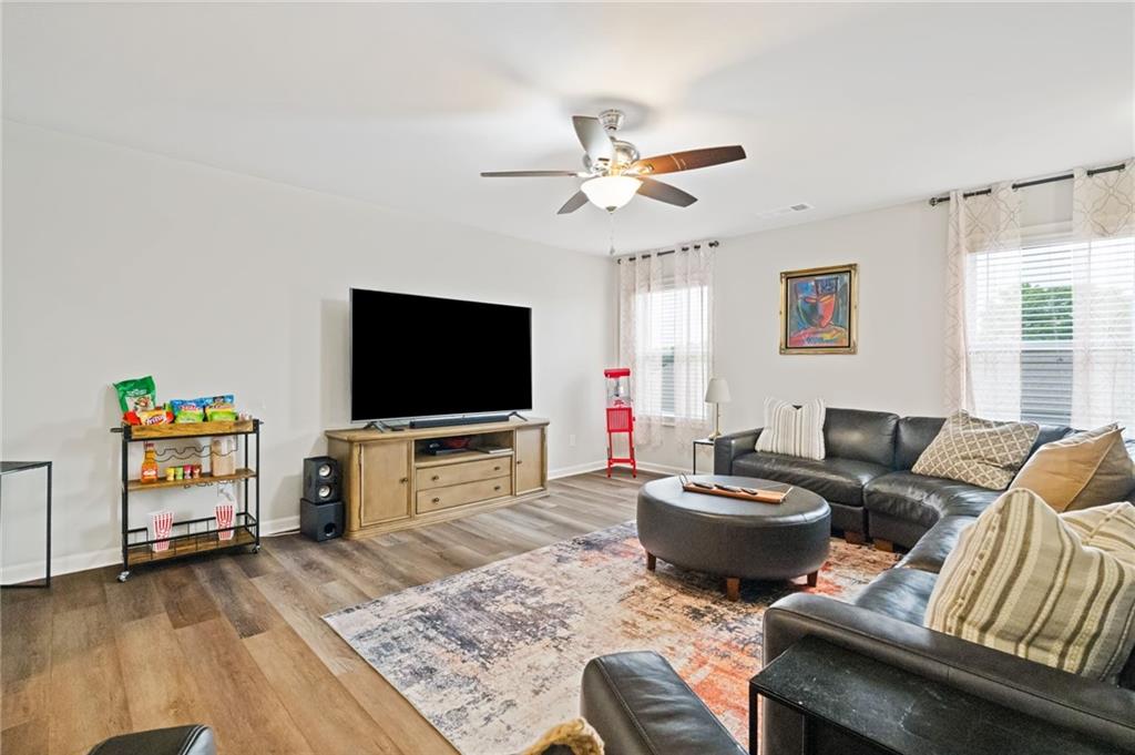304 Ellenton Place Canton, GA 30115 - Photo 39 of 76 a living room with furniture and a flat screen tv