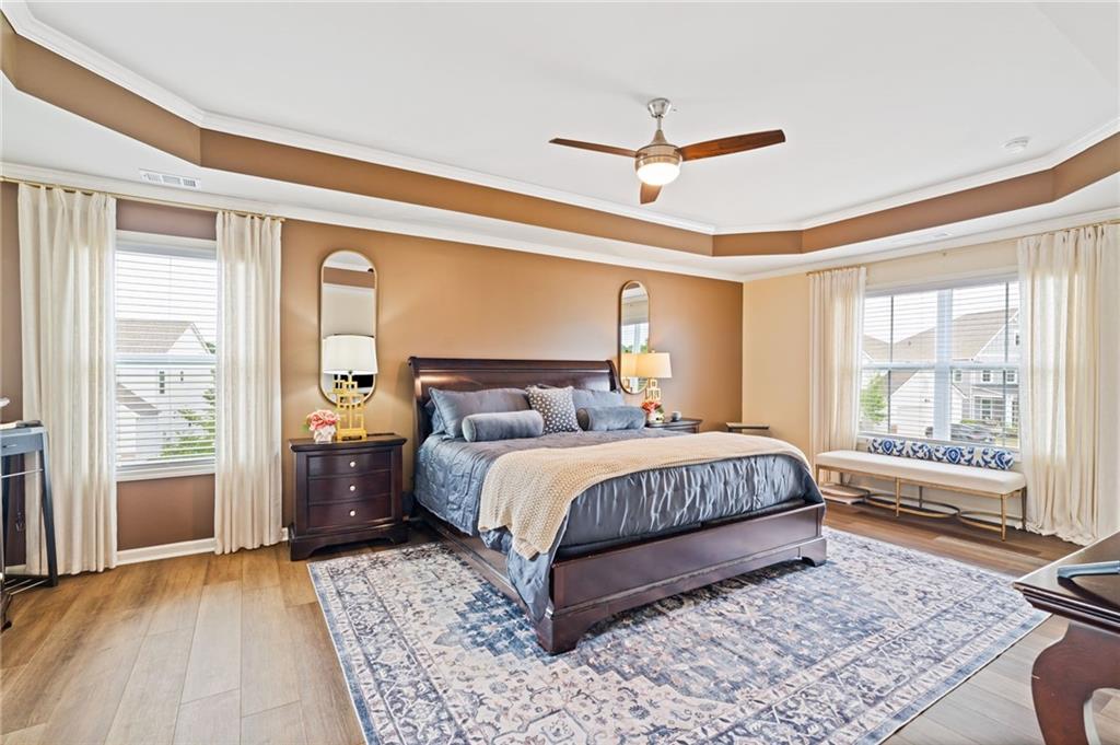 304 Ellenton Place Canton, GA 30115 - Photo 46 of 76 a bed sitting in a spacious bedroom next to a window