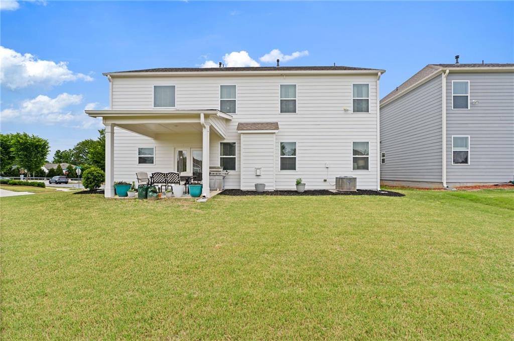 304 Ellenton Place Canton, GA 30115 - Photo 60 of 76 a view of a house with patio