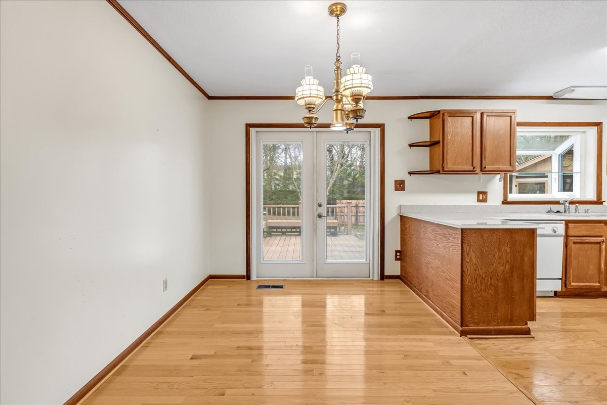 300 Marbeth Lane Tullahoma, TN 37388 - Photo 23 of 50 a view of a kitchen with a sink and dishwasher a refrigerator with wooden floor