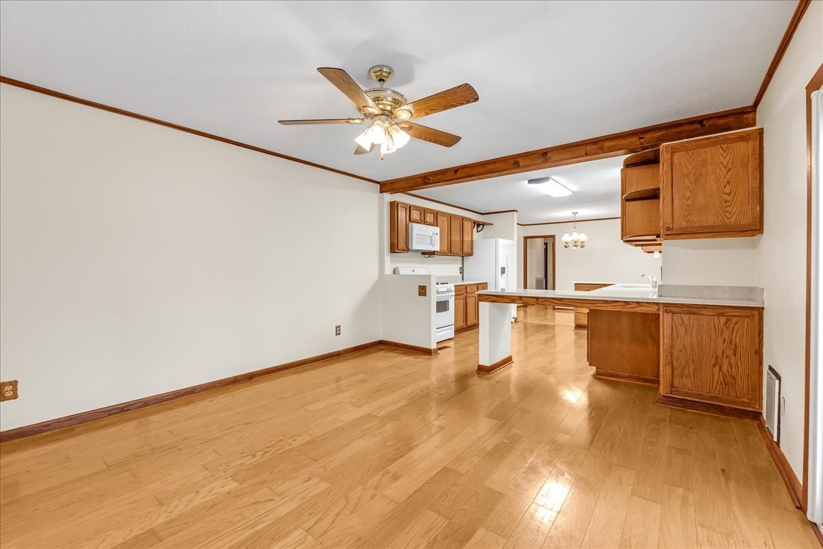 300 Marbeth Lane Tullahoma, TN 37388 - Photo 36 of 50 a view of a kitchen with wooden floor and a ceiling fan