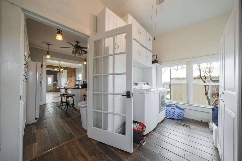 101 South Jacob Lane Winters, TX 79567 - Photo 22 of 38 a very nice looking room with wooden floor and furniture