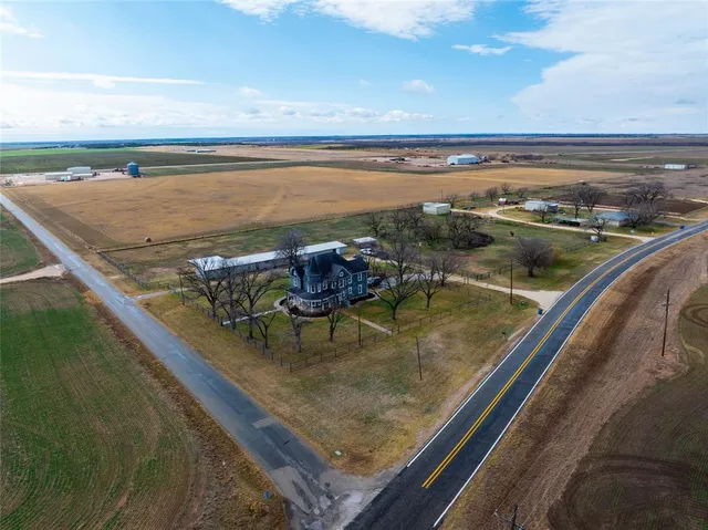 a view of a pool with a yard