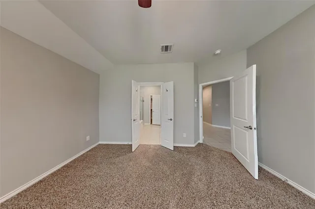 a big room with closet and windows
