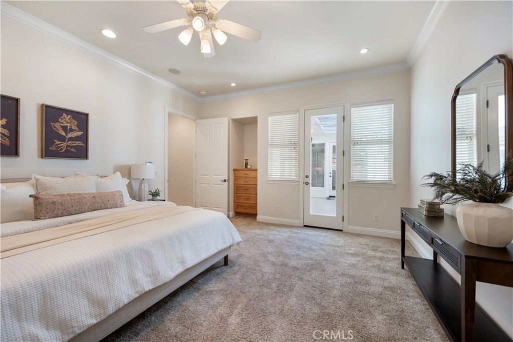 920 Wigeon Way Arroyo Grande, CA 93420 - Photo 17 of 57 a bedroom with a large bed and a chandelier