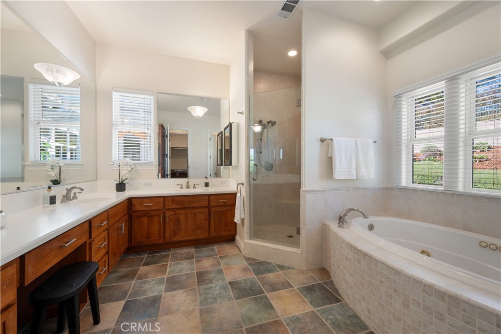 920 Wigeon Way Arroyo Grande, CA 93420 - Photo 18 of 57 a large bathroom with a large tub sink shower and mirror