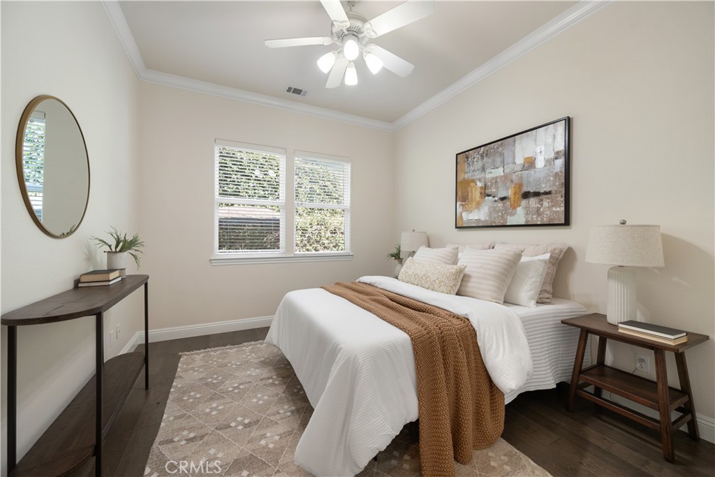 920 Wigeon Way Arroyo Grande, CA 93420 - Photo 28 of 57 a bedroom with a bed and a chandelier