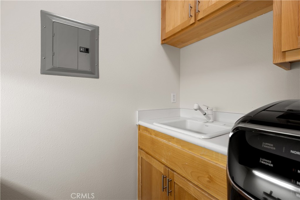 920 Wigeon Way Arroyo Grande, CA 93420 - Photo 32 of 57 a bathroom with a sink and a mirror
