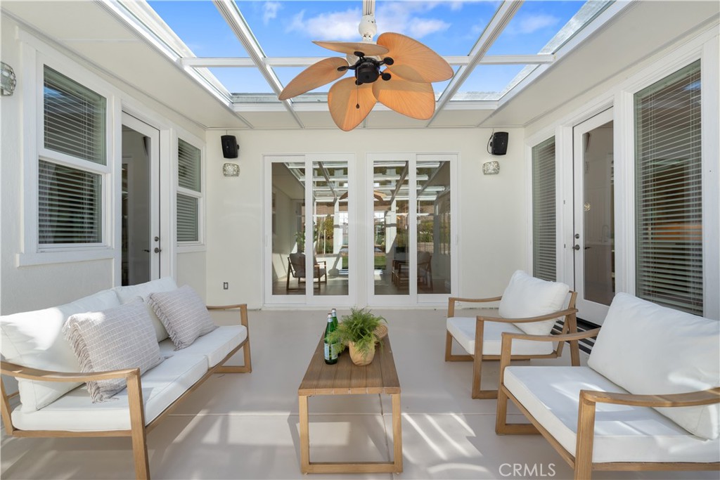 920 Wigeon Way Arroyo Grande, CA 93420 - Photo 34 of 57 a living room with furniture and floor to ceiling windows
